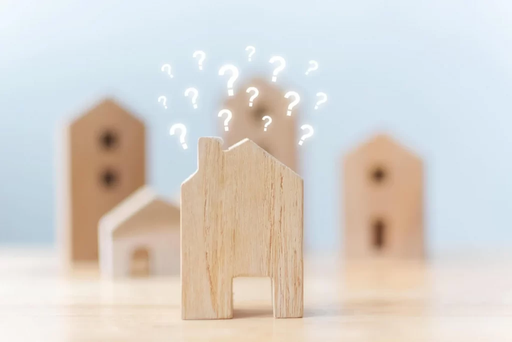 Wooden California house with question marks above