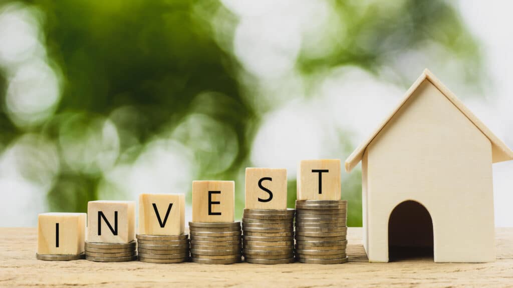 Learn the different California investment property classes Model Los Angeles investment house with coin stacks