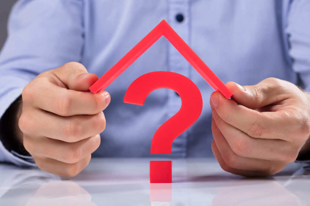 Pasadena landlord holds a roof over a question mark of landlord insurance.